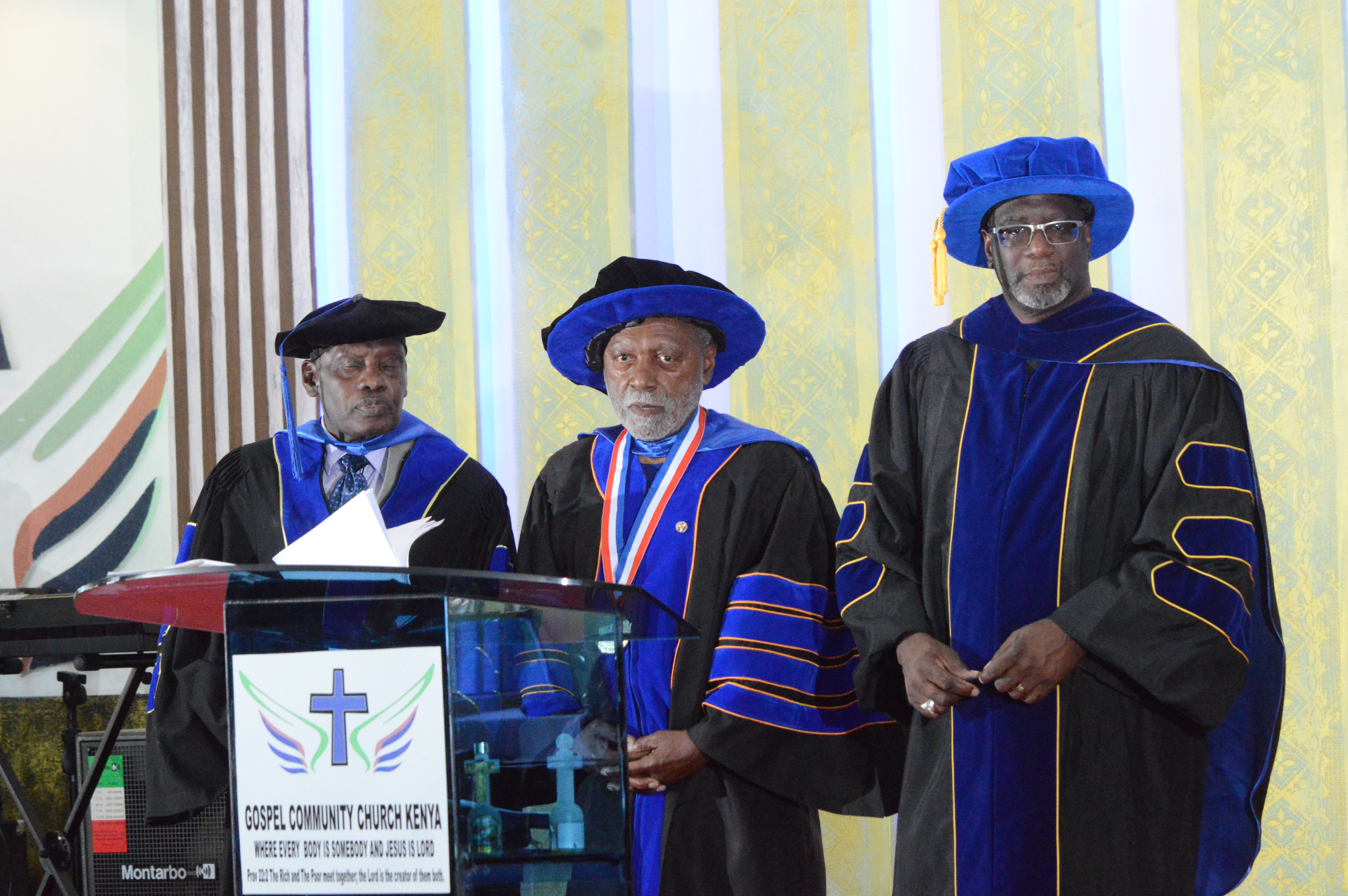 Three seminary leaders at the commencement lectern