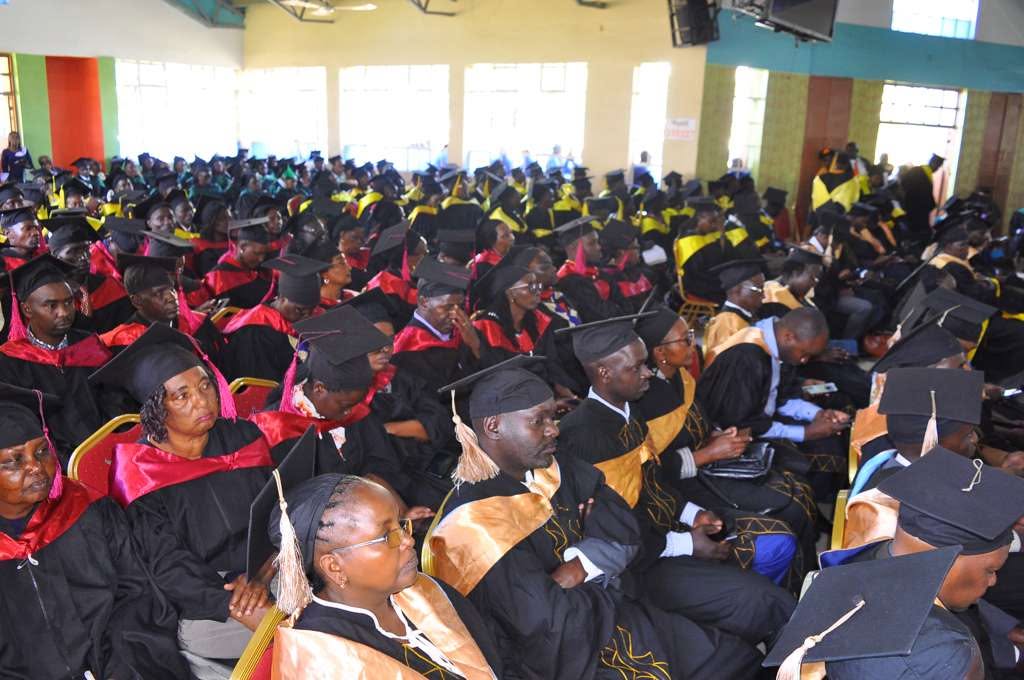 Graduates seated inside the ceremony hall