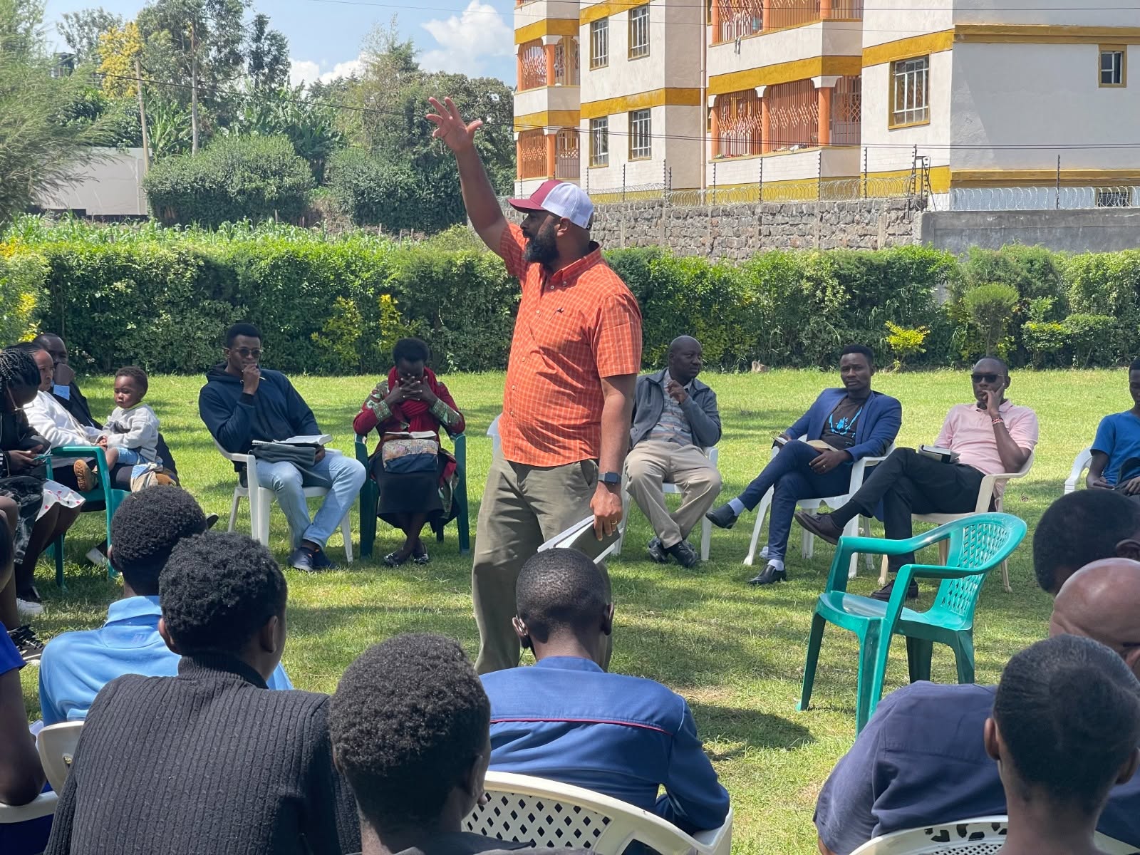 An outdoor learning discussion with community members